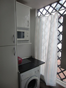 Kitchen utility room.. fridgefreezer.. washing machine.. microwave..